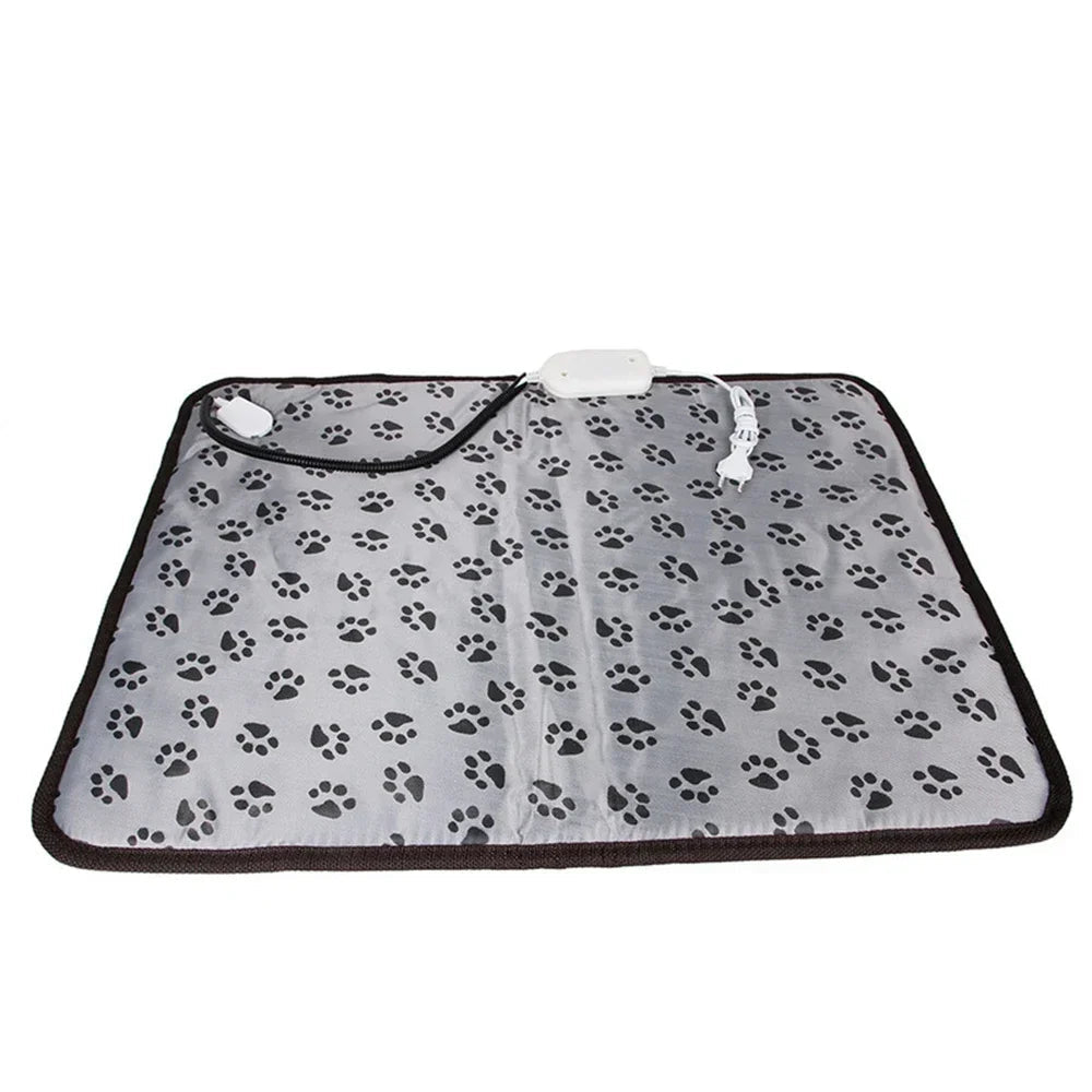 Grey electric heated pet mat with black paw print pattern, power cord and temperature controller