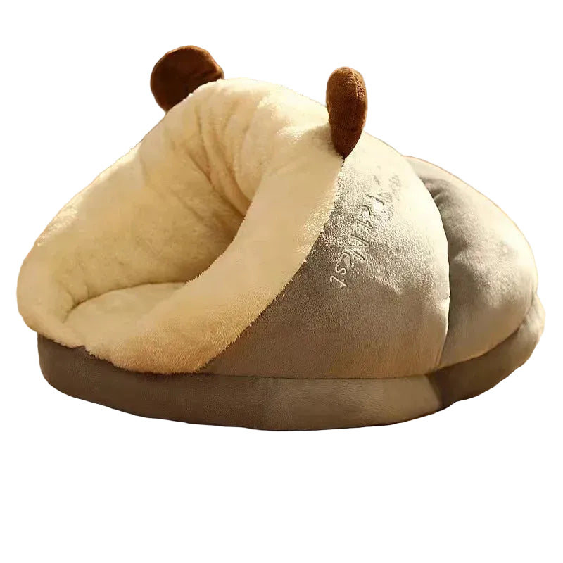 Grey plush covered pet bed with soft cream lining and cushioned enclosed design for cats and small dogs
