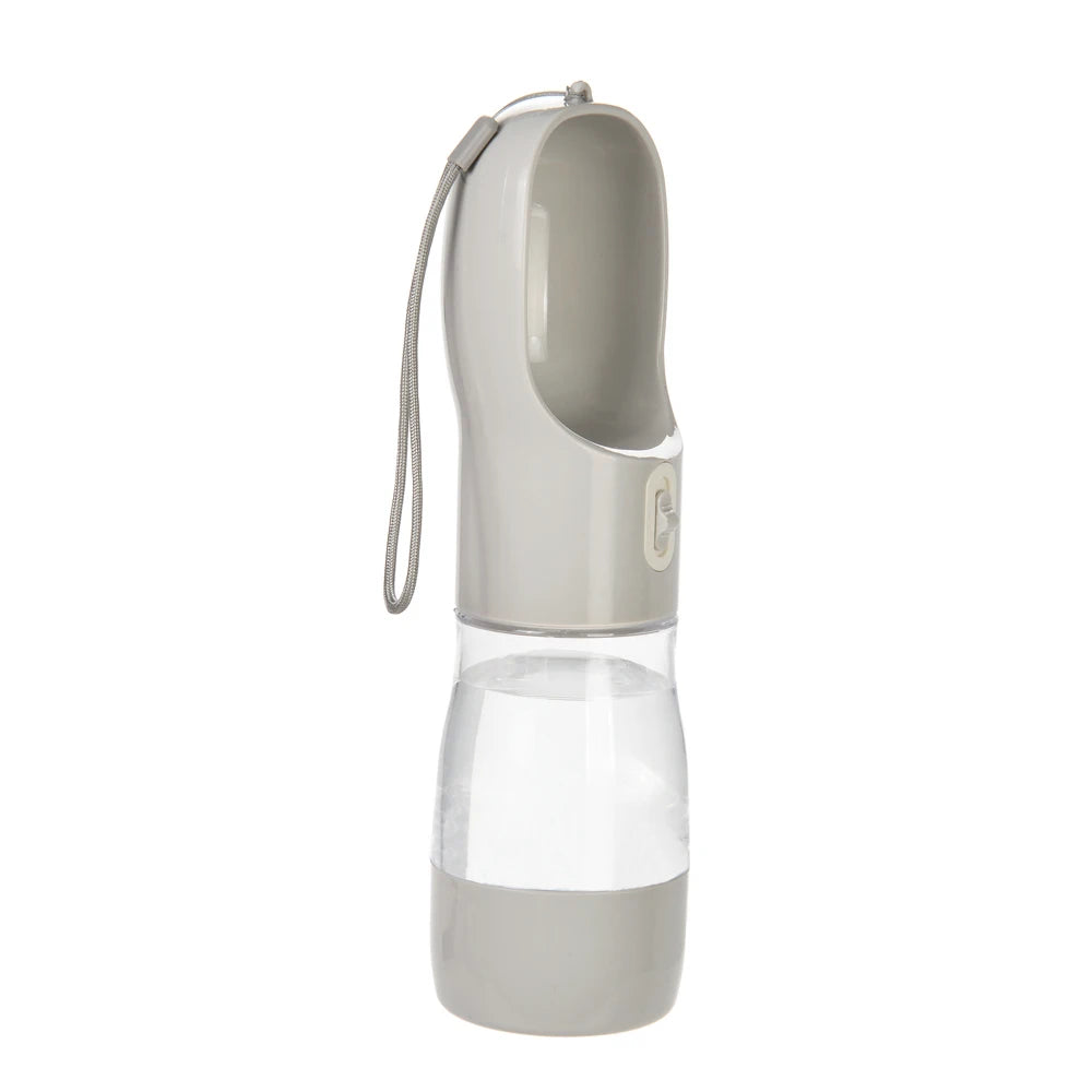 Grey portable dog water bottle with built-in drinking bowl, clear water reservoir and wrist strap