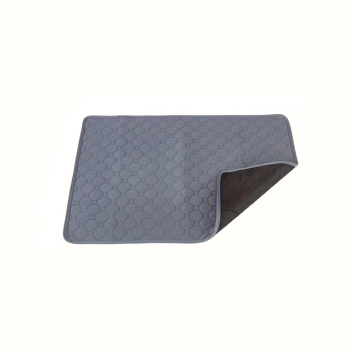 Grey quilted dog bed mat with padded honeycomb stitching and black backing shown at the corner