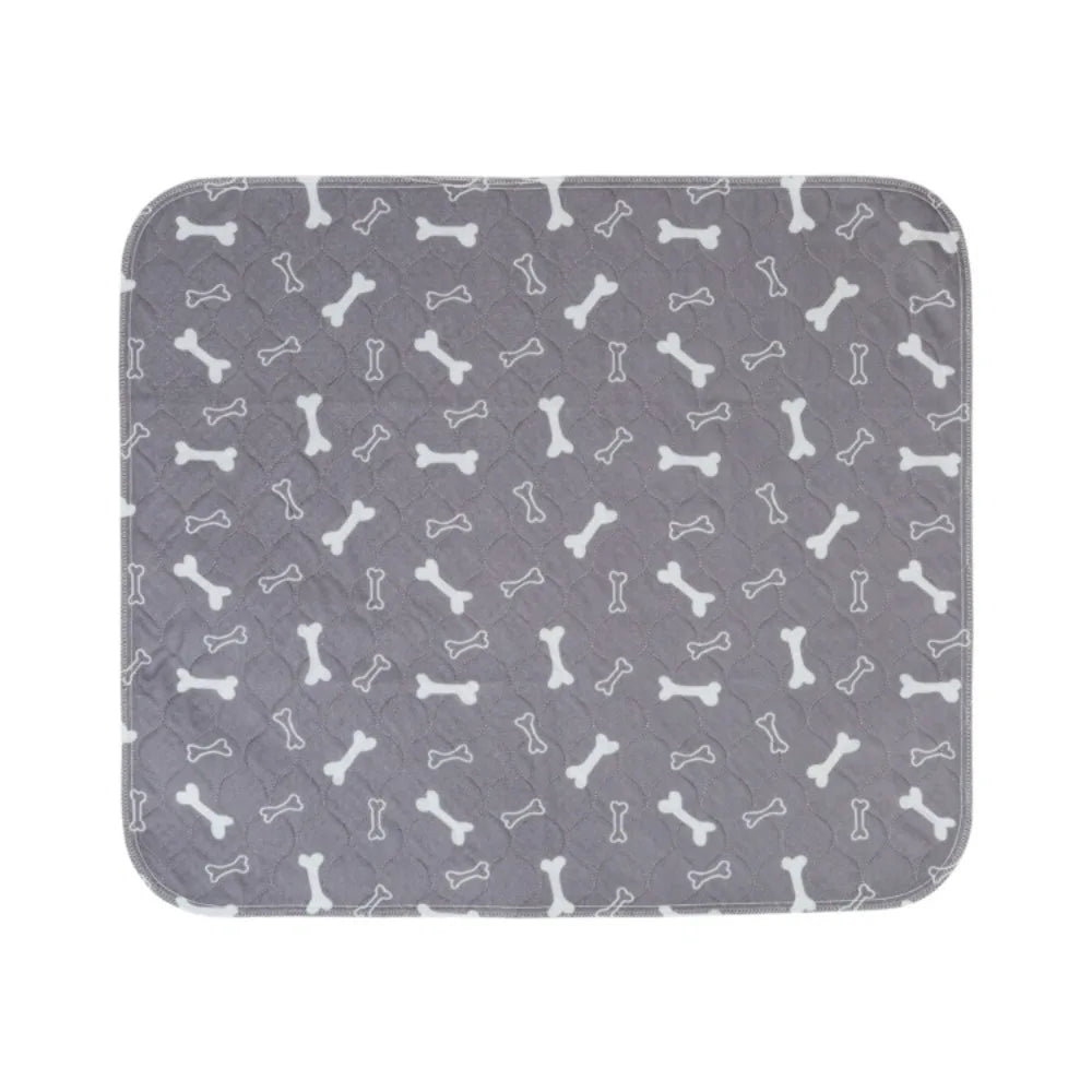 Grey quilted dog bed mat with white bone pattern, padded surface and rounded corners