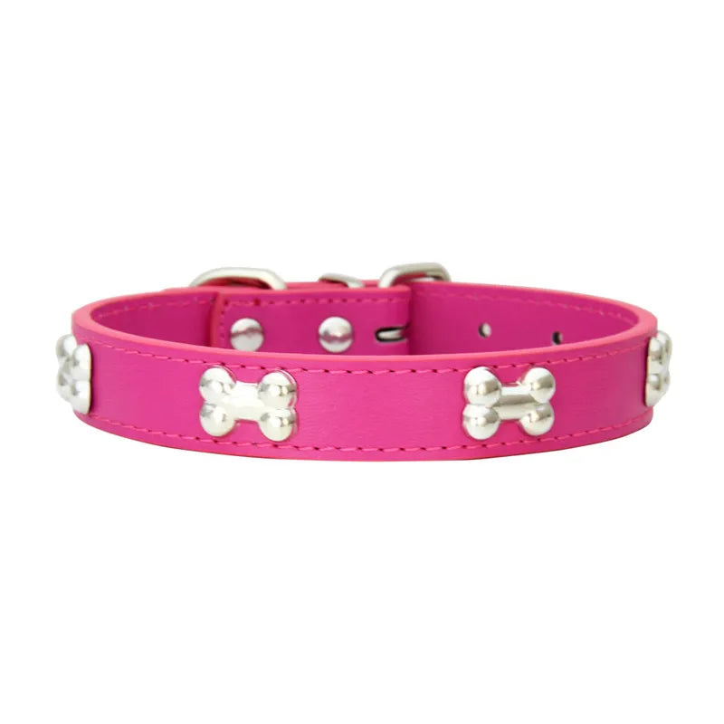 Hot pink dog collar with silver bone-shaped studs and adjustable buckle fastening