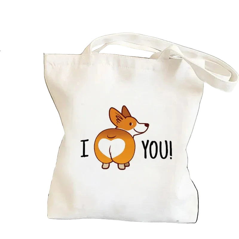 Cream canvas tote bag featuring a cartoon Corgi with a heart-shaped rear and the phrase I Love You