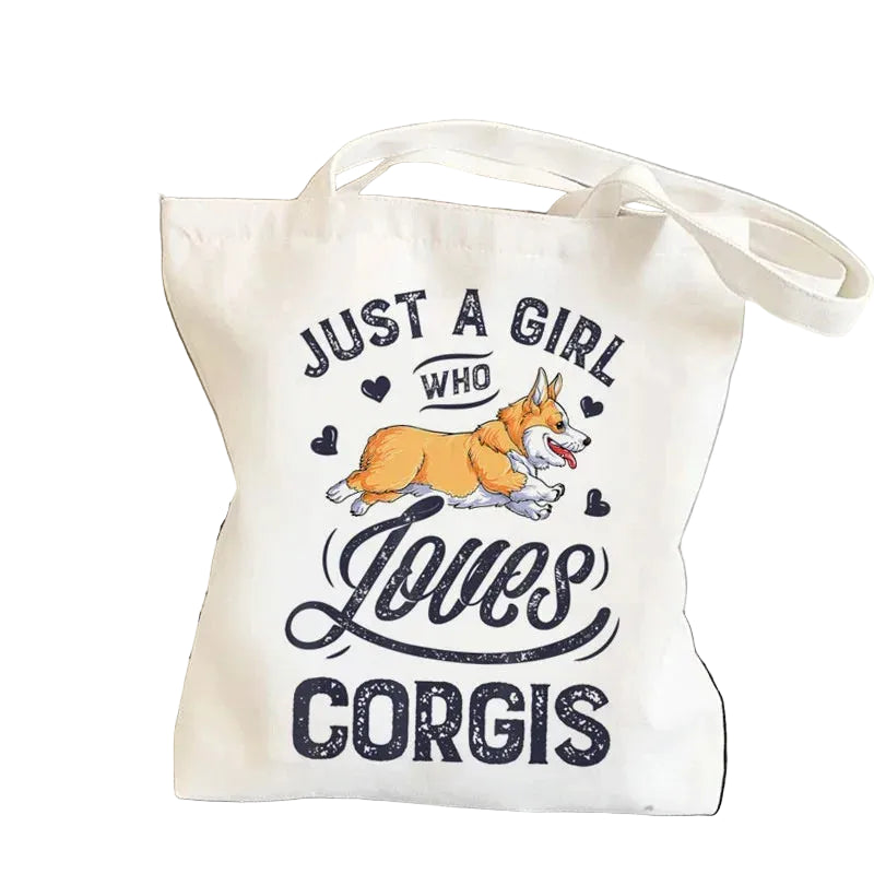 Cream canvas tote bag featuring a running Corgi with the phrase Just a Girl Who Loves Corgis