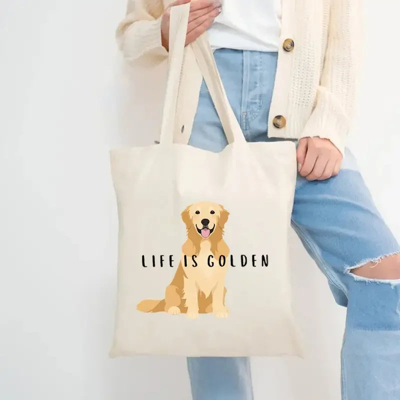 Cream canvas tote bag with Golden Retriever illustration and the phrase Life Is Golden