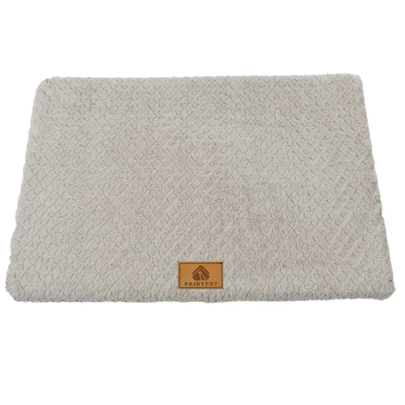 Light grey plush dog bed mat with a soft textured cushioned surface