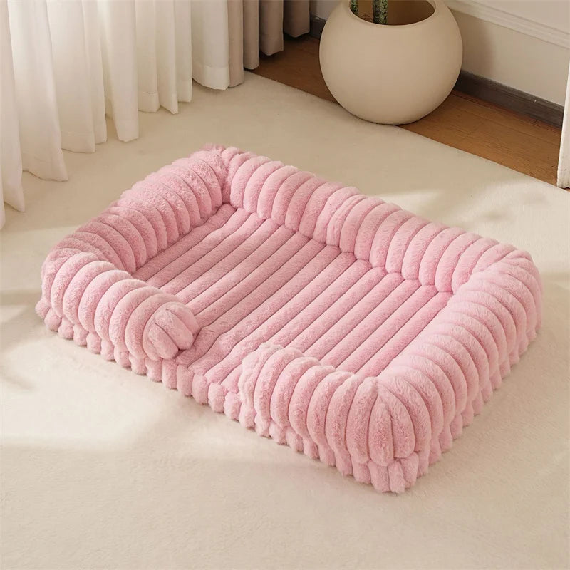 Light pink ribbed dog bed with soft padded base and raised bolster sides for dogs