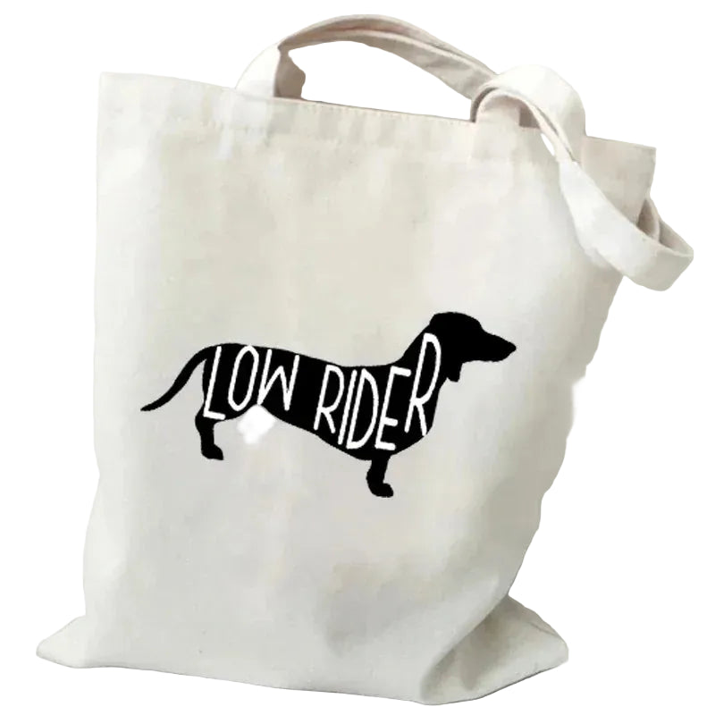 Cream canvas tote bag featuring a black Dachshund silhouette with the words Low Rider