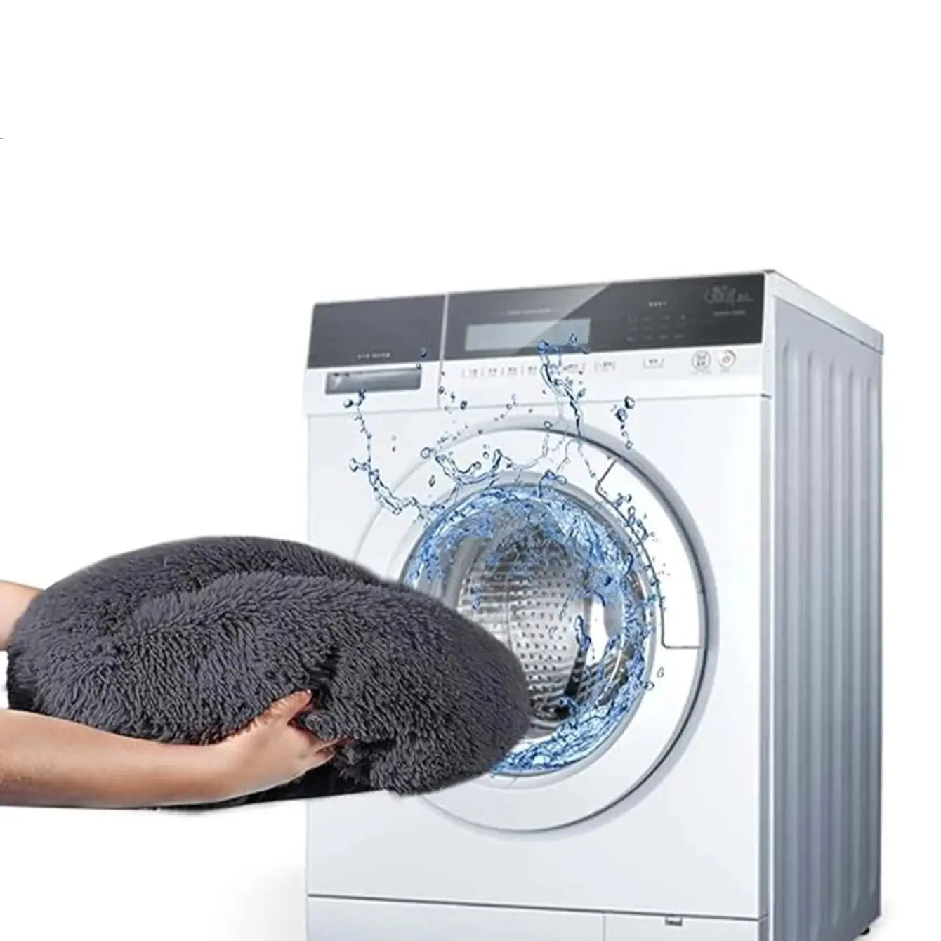 Grey plush donut pet bed being placed into a front-loading washing machine for easy cleaning
