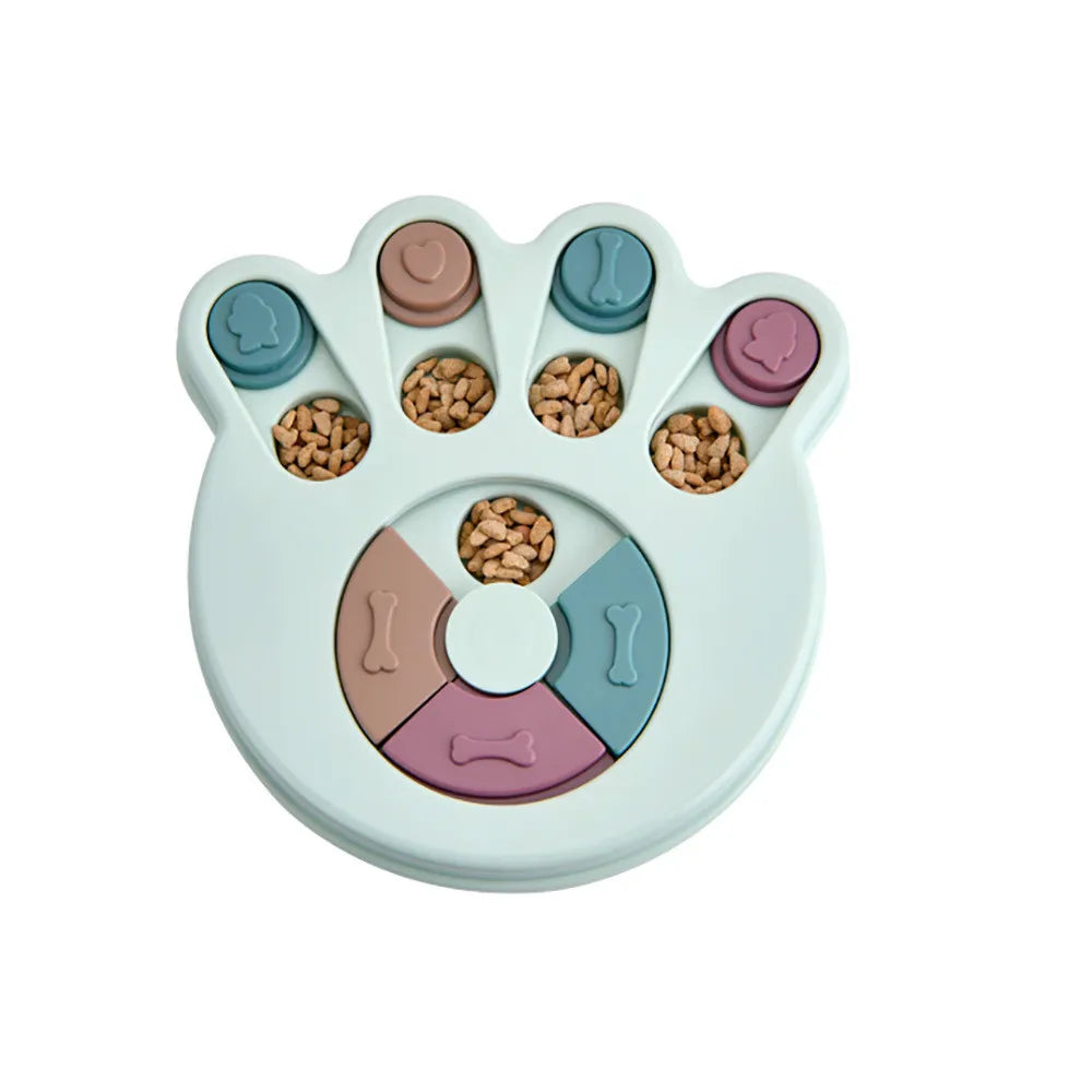 Mint paw-shaped interactive dog puzzle feeder with sliding treat compartments filled with dry dog food