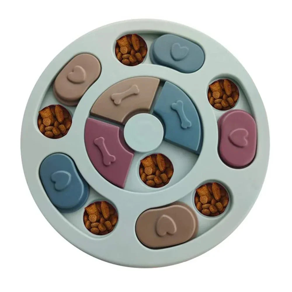 Round interactive dog puzzle feeder with sliding treat compartments filled with dry dog food