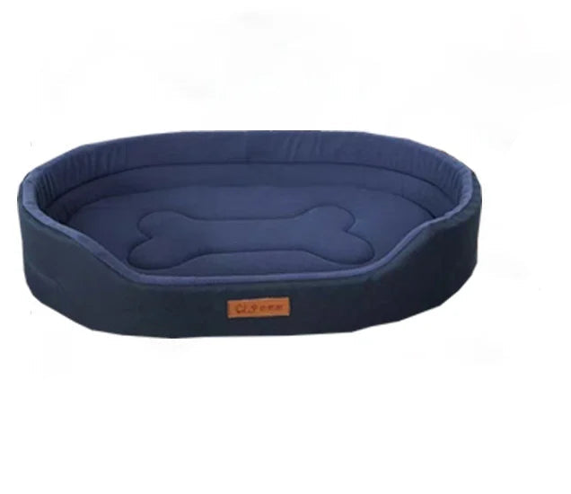 Navy blue oval dog bed with raised sides and a padded bone-shaped design in the centre