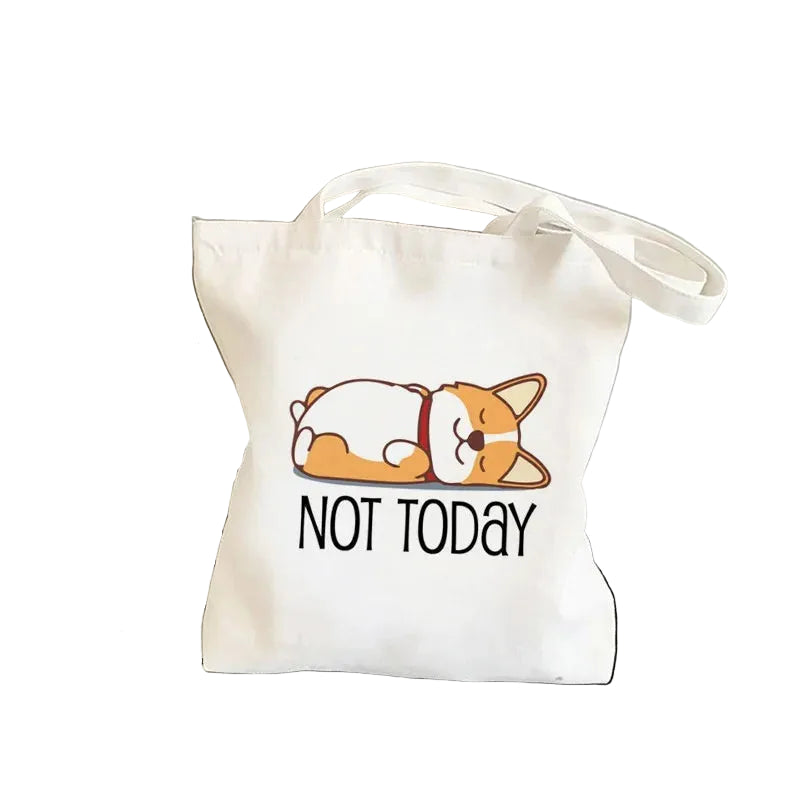 Cream canvas tote bag featuring a sleeping cartoon Corgi with the words Not Today