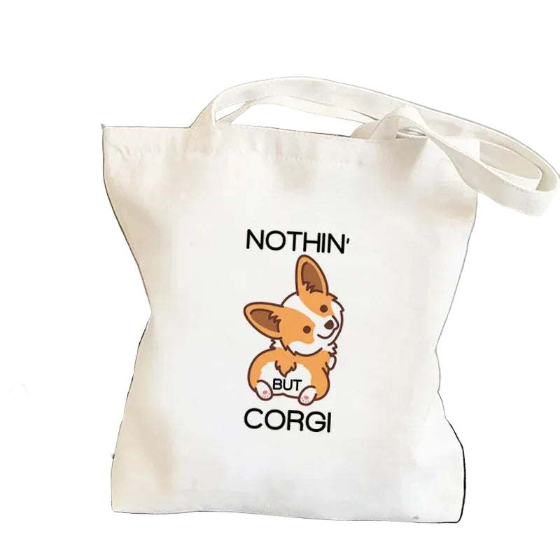 Cream canvas tote bag featuring a cartoon Corgi with the phrase Nothin' But Corgi