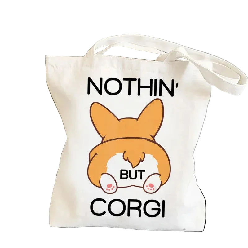 Cream canvas tote bag featuring a cartoon Corgi rear with the phrase Nothin' But Corgi