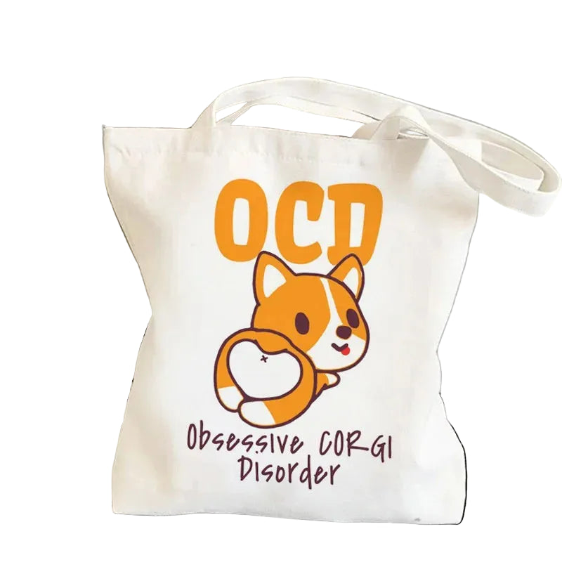 Cream canvas tote bag featuring a cartoon Corgi with the phrase OCD Obsessive Corgi Disorder