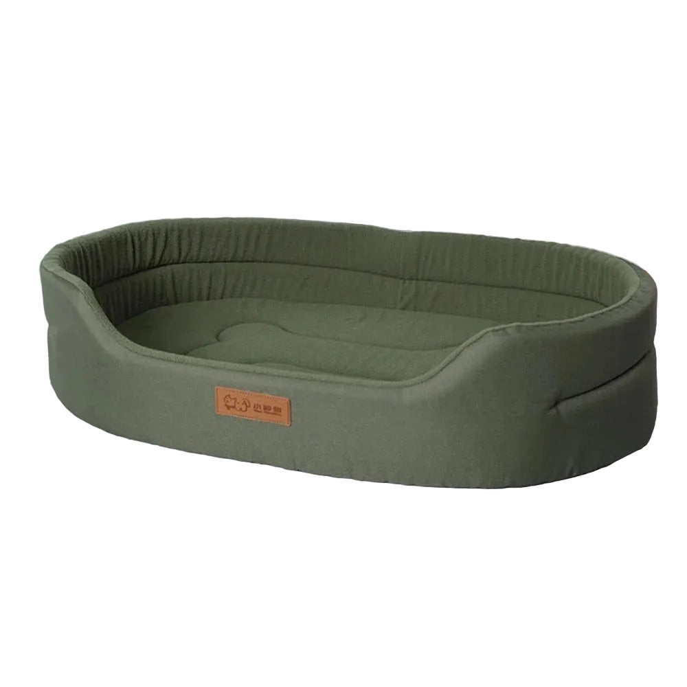 Olive green oval dog bed with raised padded sides and a low front entry