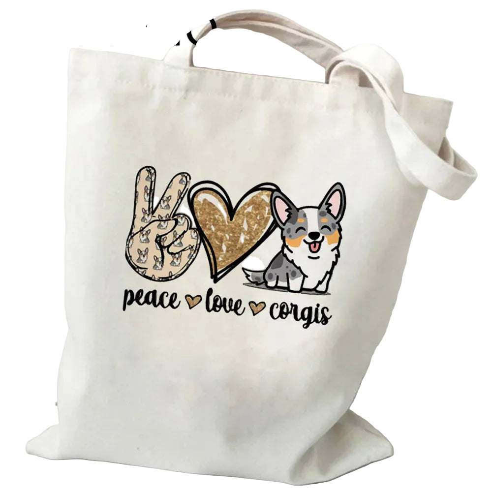 Cream canvas tote bag featuring a peace sign, heart, Corgi illustration and the words Peace Love Corgis