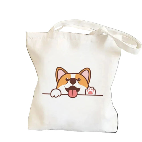 Cream canvas tote bag featuring a cartoon Corgi rear with the phrase Nothin' But Corgi