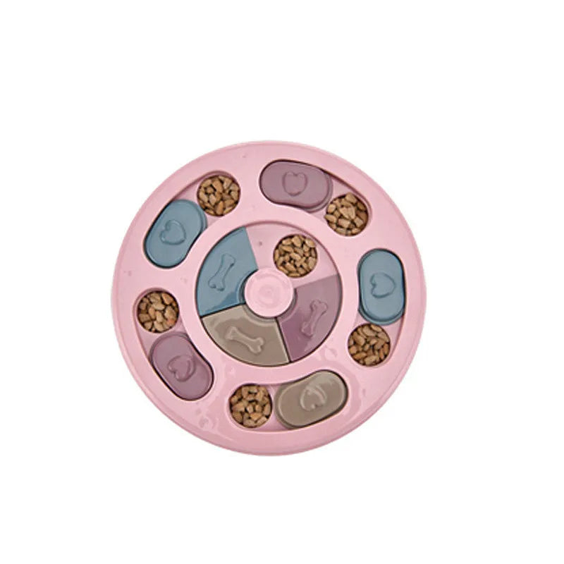 Pink interactive dog puzzle feeder with sliding compartments filled with dry dog food for enrichment and slow feeding