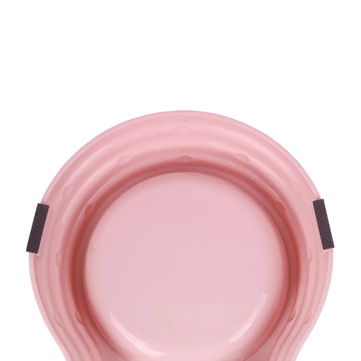 Close-up of the pink double pet bowl base showing non-slip rubber pads for added stability