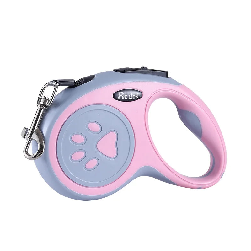 Pink and grey retractable dog leash with paw print design, ergonomic handle and metal leash clip