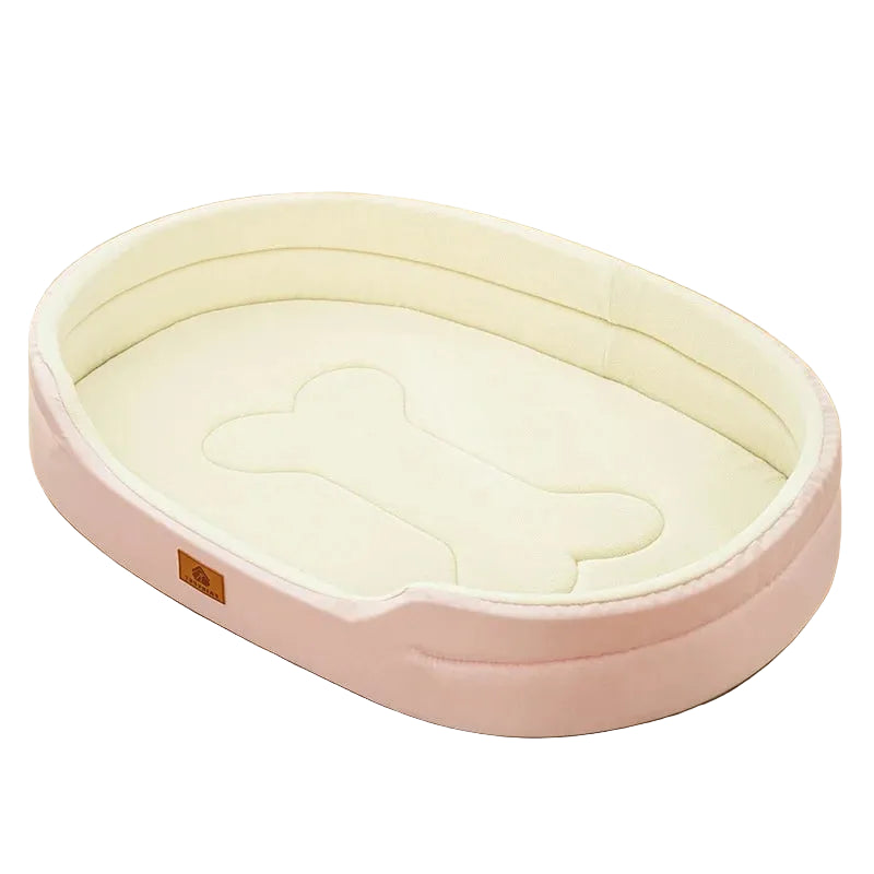 Pink oval dog bed with cream padded interior, raised sides and a bone-shaped cushion design