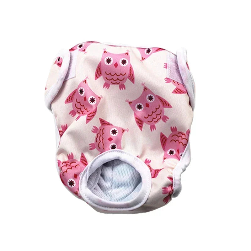 Pink reusable female dog diaper with owl print, tail hole and adjustable fastening