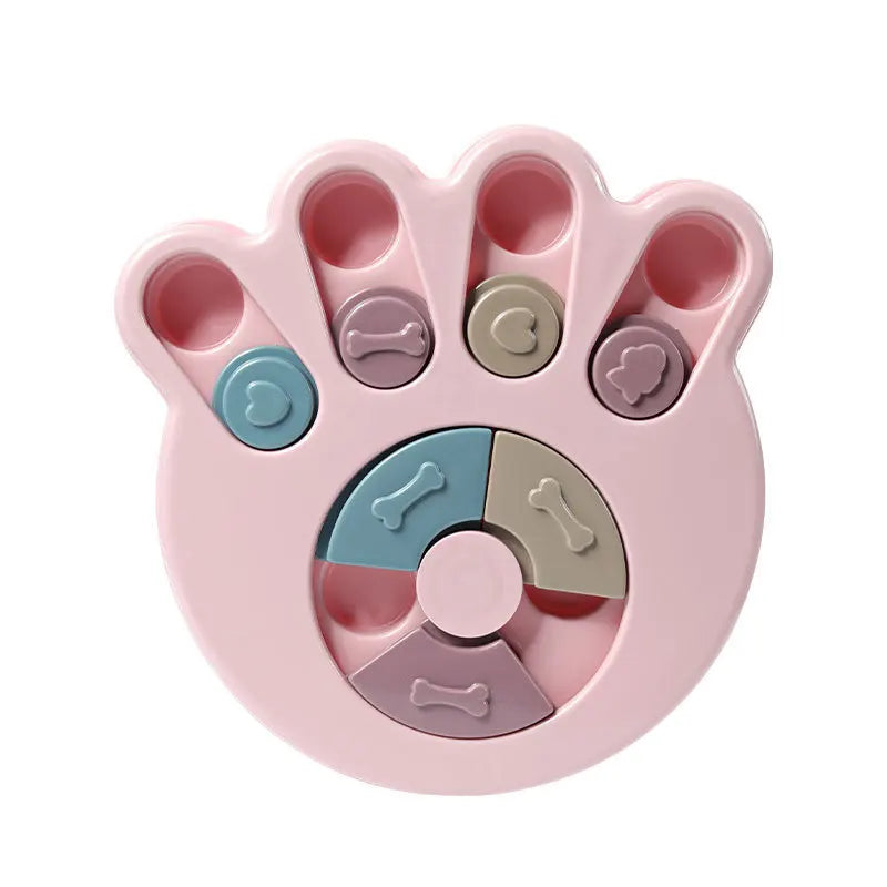 Pink paw-shaped interactive dog puzzle feeder with sliding treat compartments and bone-shaped covers