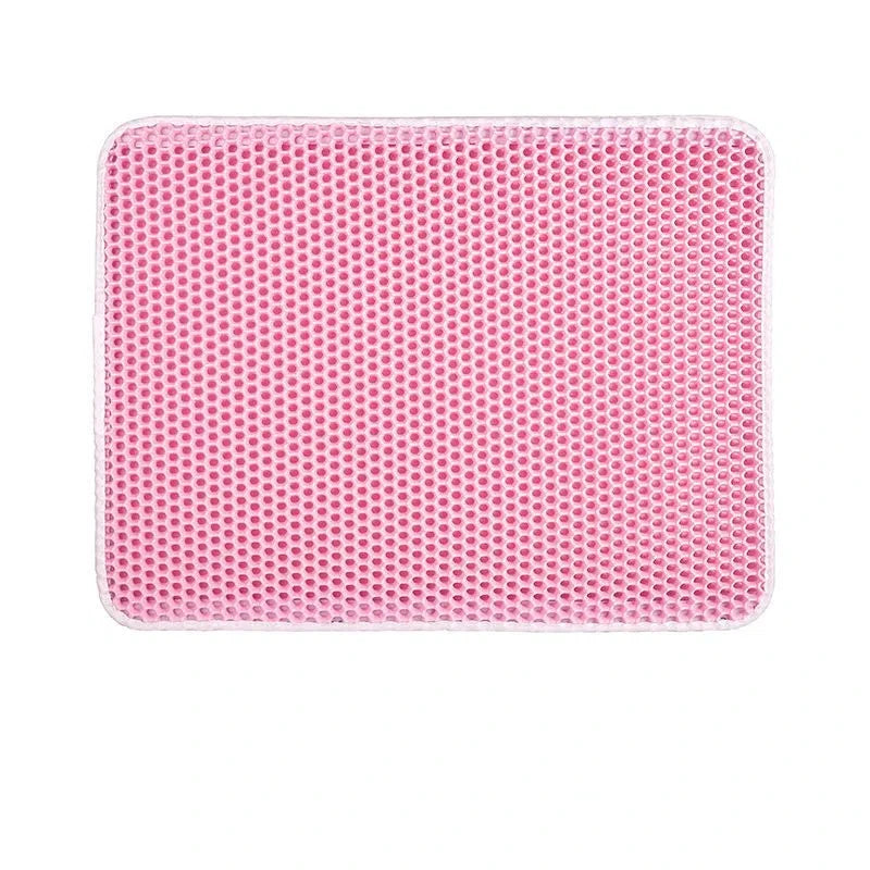 Pink rectangular pet mat with perforated non-slip surface and rounded corners