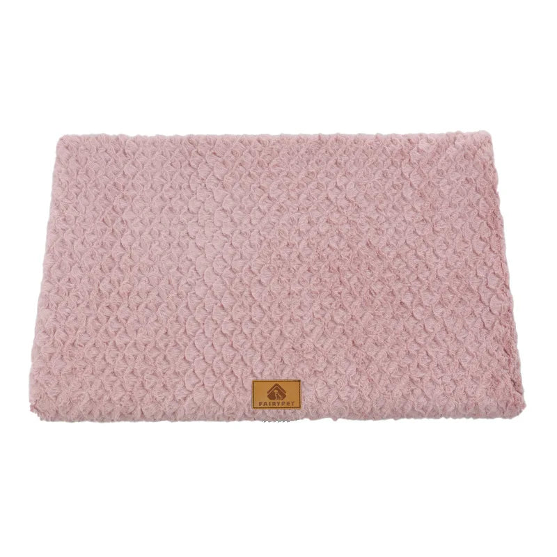 Pink plush dog bed mat with a soft textured cushioned surface