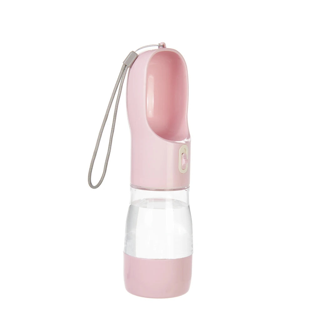 Pink portable dog water bottle with built-in drinking bowl, clear water reservoir and wrist strap