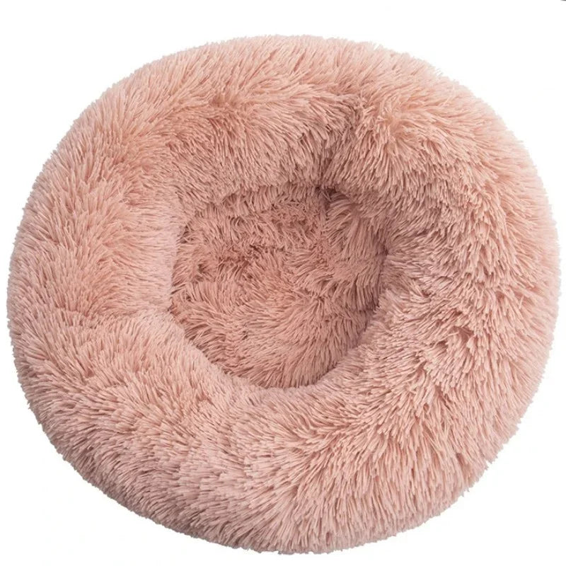 Pink round plush donut pet bed with soft faux fur and raised cushioned sides for cats and small dogs