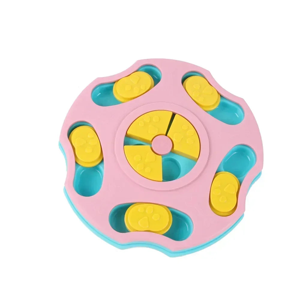 Pink interactive dog puzzle feeder with yellow sliding covers and rotating treat compartments for enrichment and slow feeding