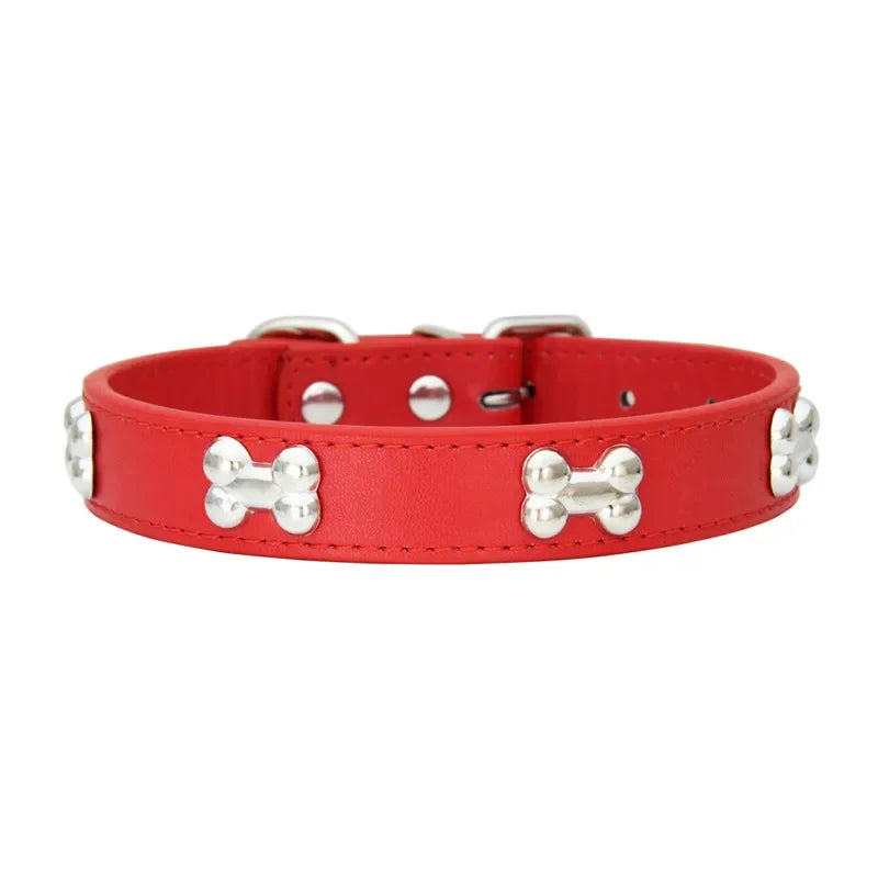 Red dog collar with silver bone-shaped studs and adjustable buckle fastening