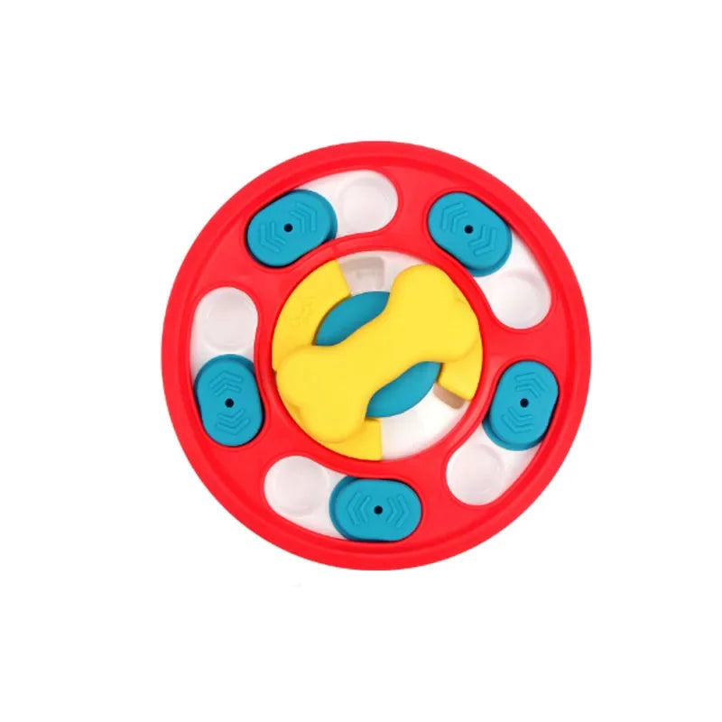 Red round interactive dog puzzle feeder with blue sliding treat covers and a yellow bone-shaped centre spinner