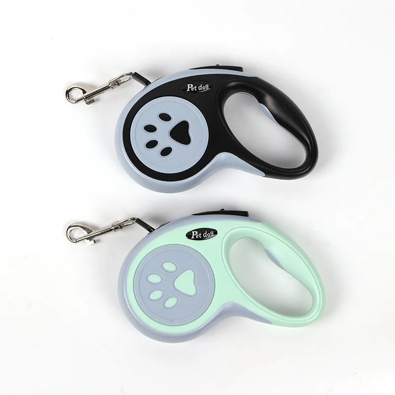 Black and mint green retractable dog leashes with paw print design, ergonomic handles and metal leash clips