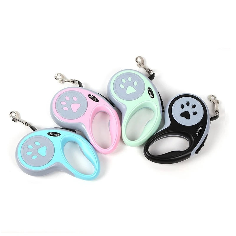 Four retractable dog leashes with paw print design shown in blue, pink, mint green and black colour options