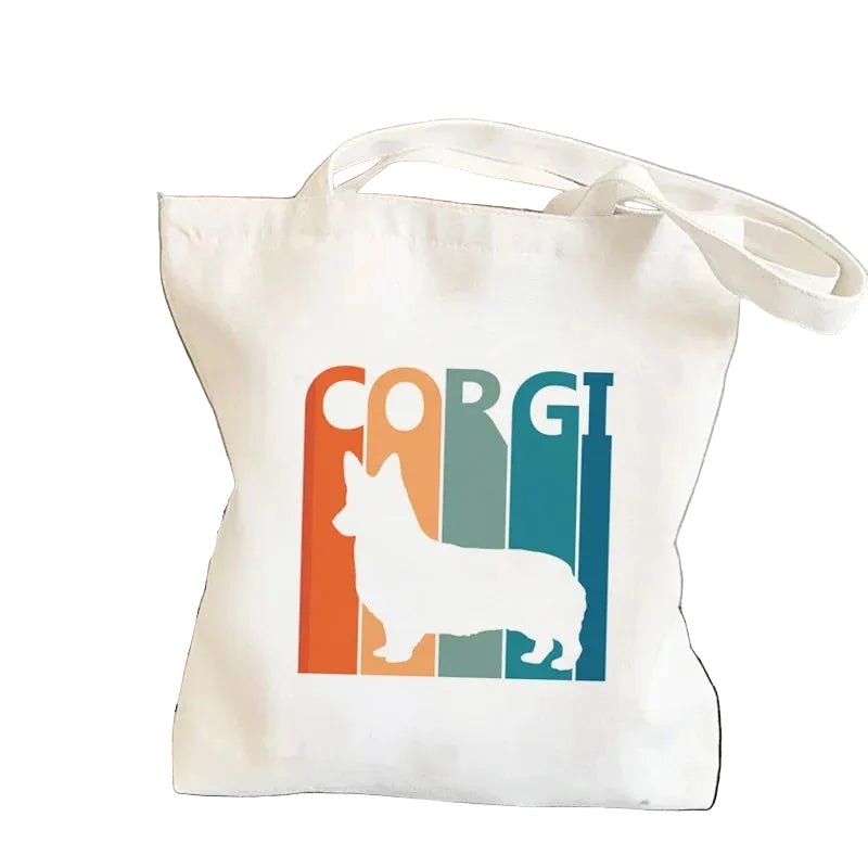 Cream canvas tote bag featuring a Corgi silhouette over a retro multicolour stripe design