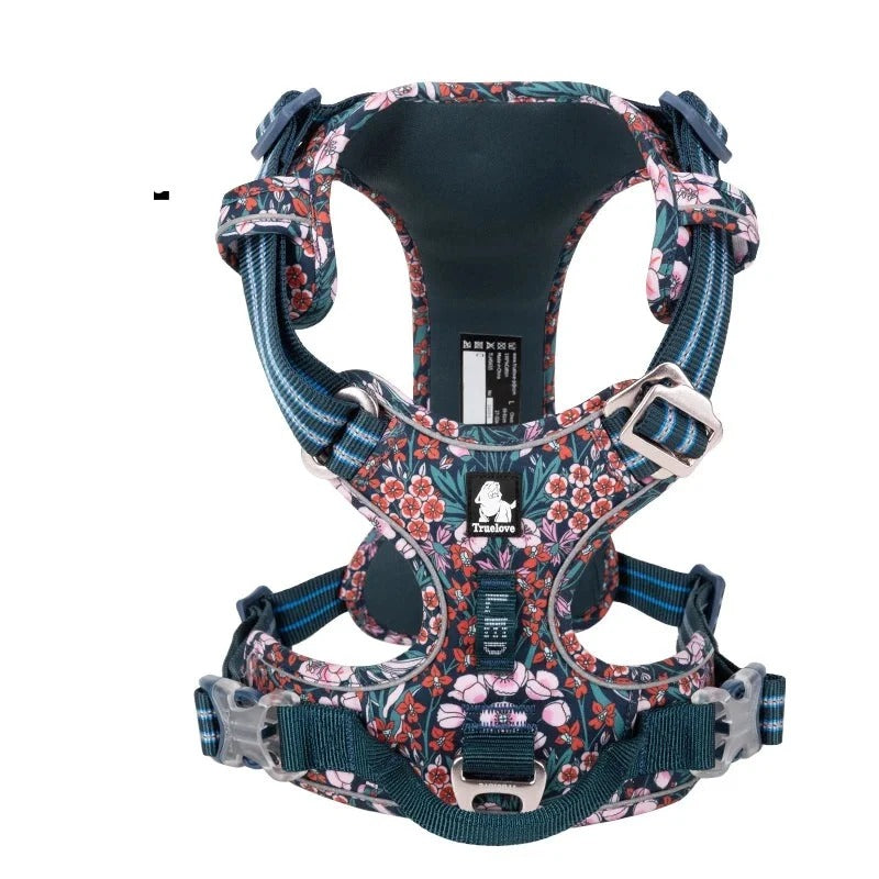 Patterned dog travel harness in floral navy, front view on white