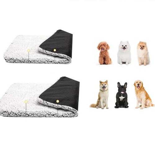 Grey and white cat lying on a soft self-warming pet mat with plush fleece surface