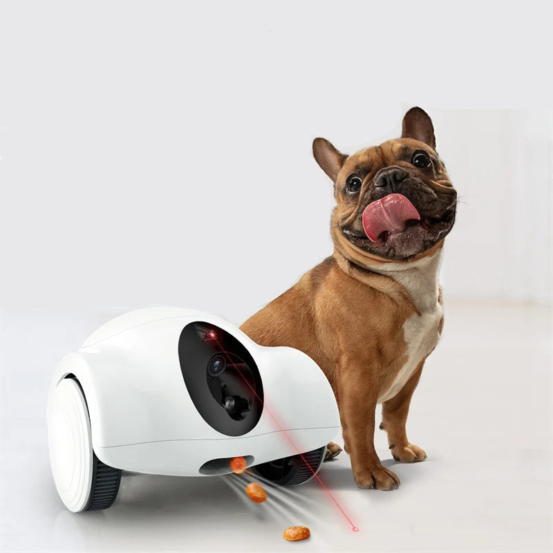 French Bulldog beside a smart pet camera robot dispensing treats with an interactive laser feature