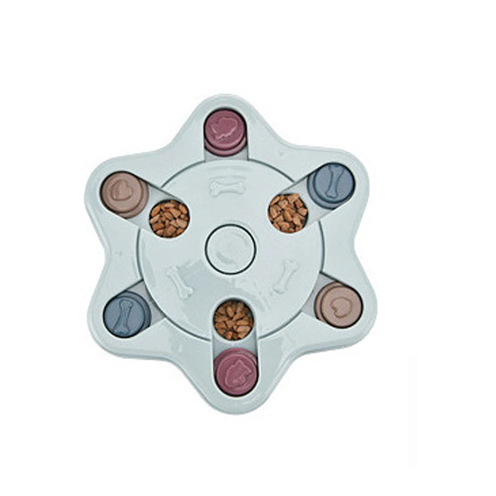 Star-shaped interactive dog puzzle feeder with sliding treat compartments filled with dry dog food