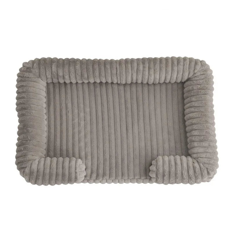 Taupe ribbed dog bed with soft padded base and raised bolster sides for dogs