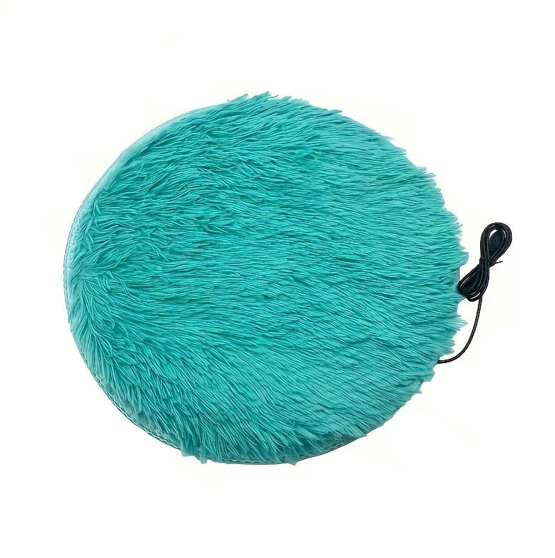 Teal round electric heated pet mat with soft plush surface and attached power cord