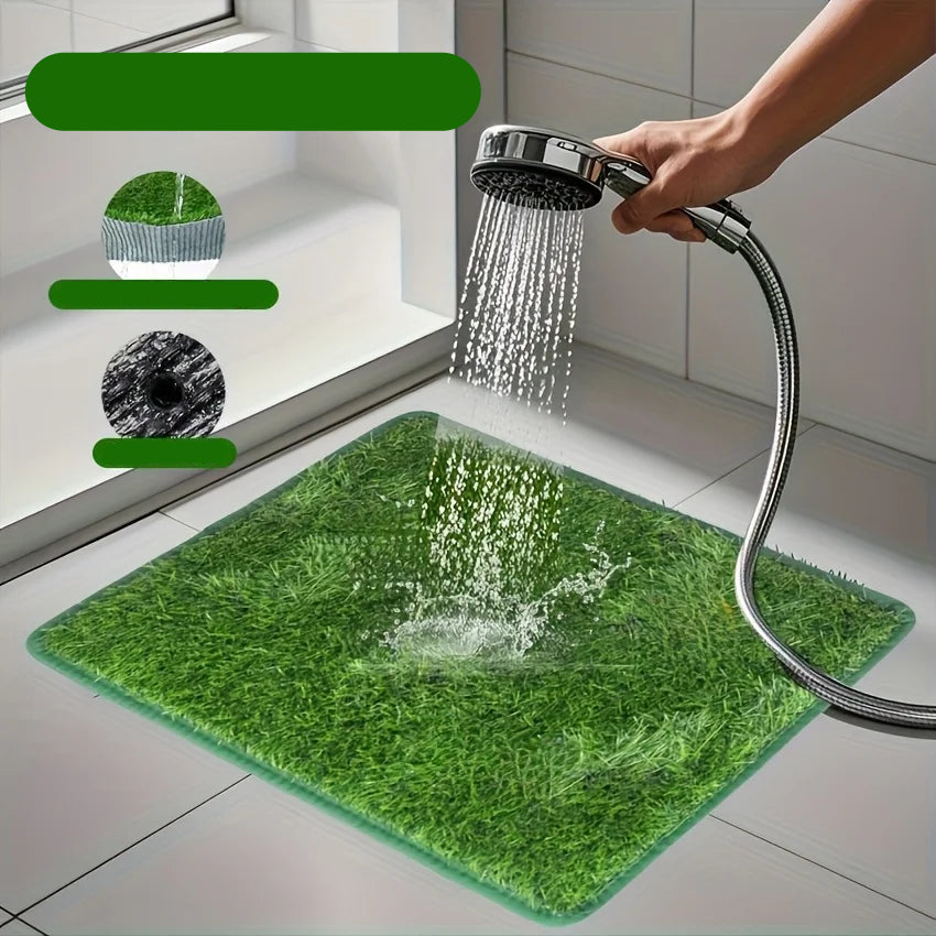 Artificial grass dog potty training mat being rinsed with water to show its washable, easy-clean design
