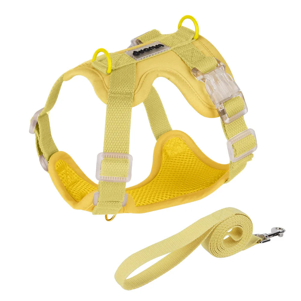 Yellow adjustable mesh dog harness with padded chest support, clear buckles, metal leash rings and matching yellow leash