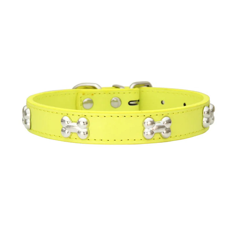 Yellow dog collar with silver bone-shaped studs and adjustable buckle fastening