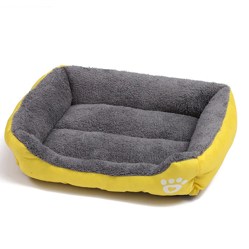 Yellow and grey plush bolster dog bed with soft padded base, raised cushioned sides and paw print detail