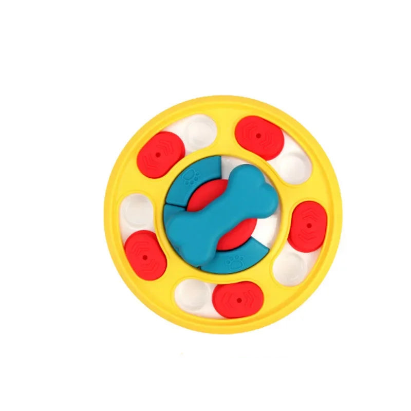Yellow round interactive dog puzzle feeder with red sliding treat covers and a blue bone-shaped centre spinner